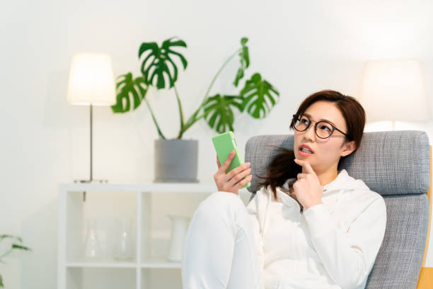 istock asian woman to see a smart phone,think, 1251048621