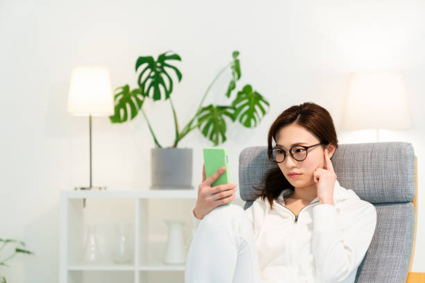 istock asian woman to see a smart phone,think, 1251048695