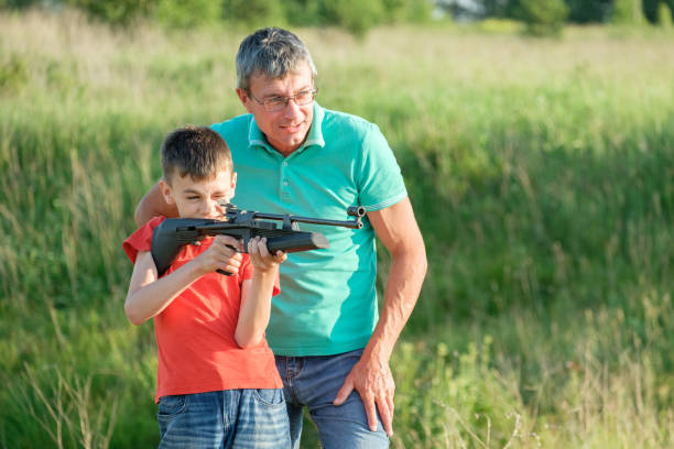istock Father and Son Rifle Lessons 1251054640