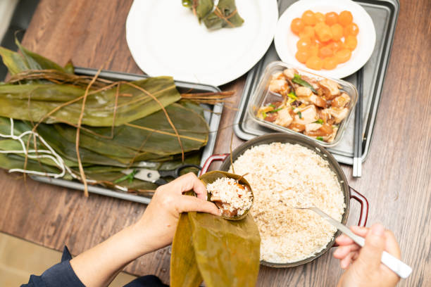 istock Making Chinese dumplings - Zongzi 1251058329