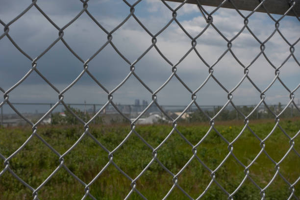 Chain Link Mesh Fence with Calgary downtown skyline in distance