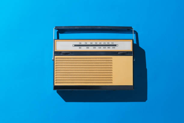 istock Vintage radio in bright light on a blue background. Vintage technique. 1251061034