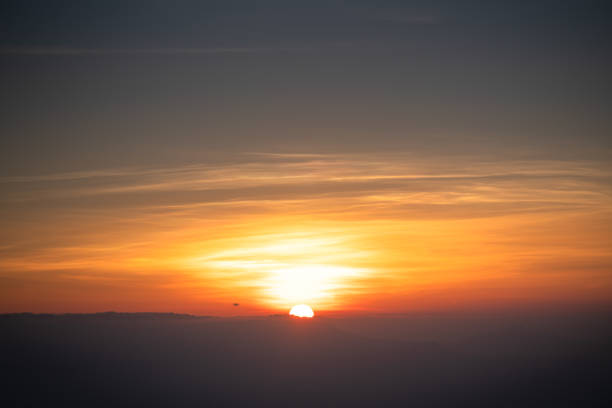 istock Colorful sunset / Sunrise sky nature background clouds with beautiful sunlight 1251061769