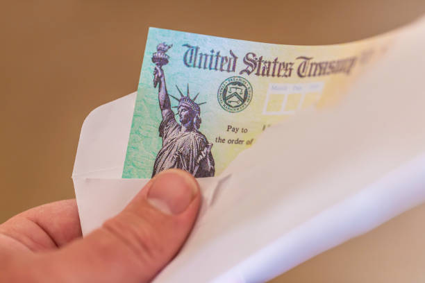 US Treasury Check US Treasury Check. Used for tax refunds and also the Covid-19/coronia virus stimulus payments in 2020 attraction studio photography stock pictures, royalty-free photos & images