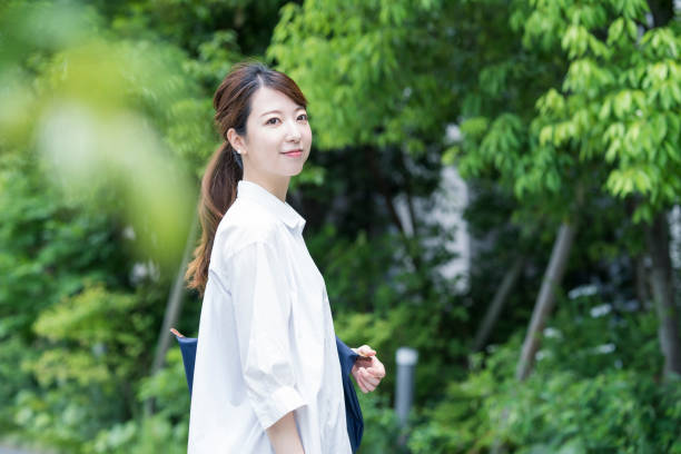istock Asian woman taking a walk 1251073776