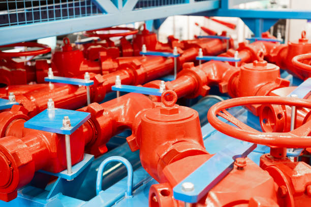 Drilling equipment. Manifold unit, a lot of powerful pipelines and valves Drilling equipment. Manifold unit, a lot of powerful pipelines and valves. permian basin stock pictures, royalty-free photos & images