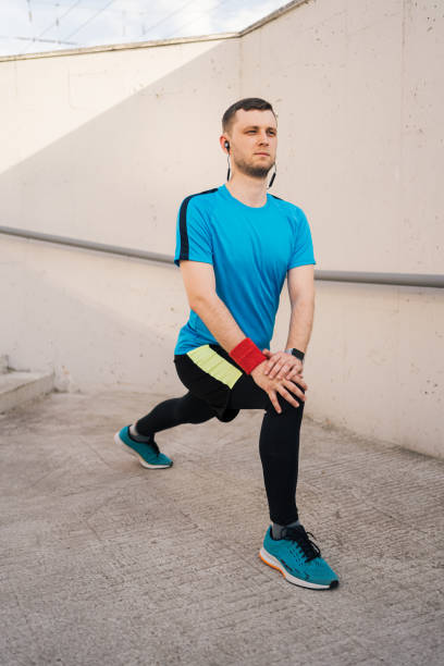istock Caucasian man stretching city workout 1251076648