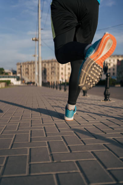 istock Fit man running legs in the city 1251076685