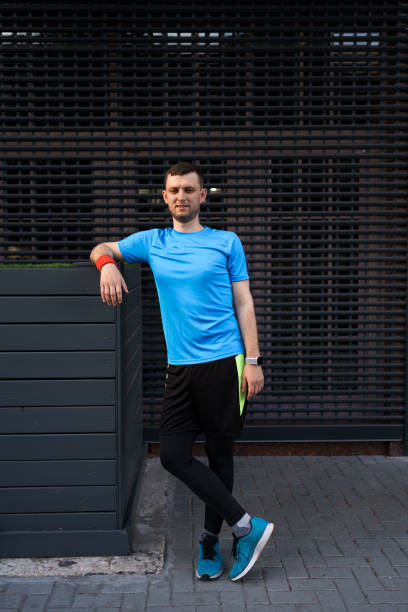 istock Sporty man portrait over gray background 1251076743