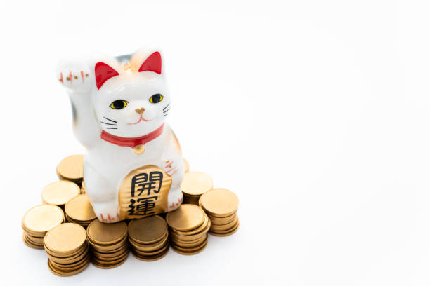 istock Beckoning cat and gold coins,Lucky cat 1251080427