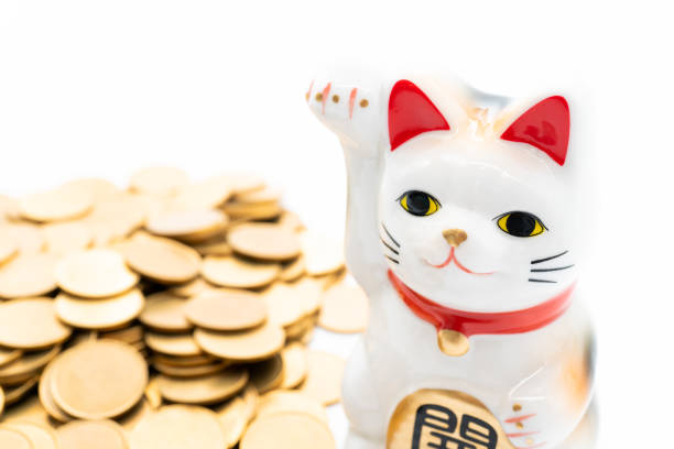 istock Beckoning cat and gold coins,Lucky cat 1251080430