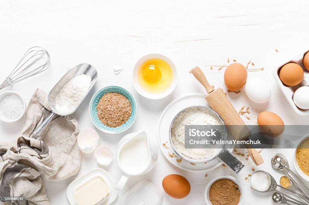 Baking homemade bread on white kitchen worktop with ingredients for cooking, culinary background, copy space, overhead view Baking Stock Photo