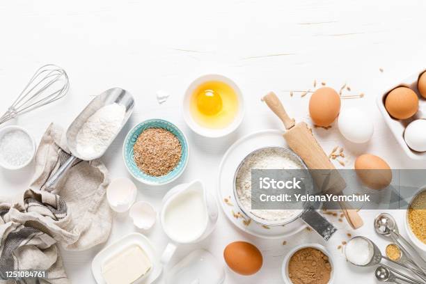 Baking Homemade Bread On White Kitchen Worktop With Ingredients For Cooking Culinary Background Copy Space Overhead View Stock Photo - Download Image Now