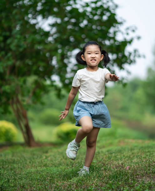 istock Cute little Girl Running 1251084821