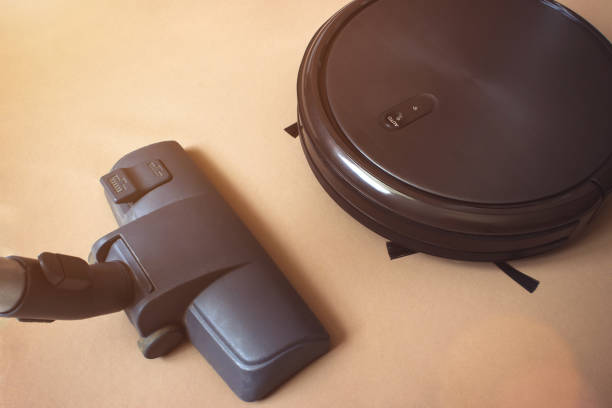 istock Robotic vacuum cleaner. Smart life technology concepts. housework and technology concept. 1251085096