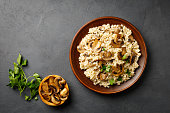 Traditional italian cuisine meal - vegetarian risotto with mushrooms.