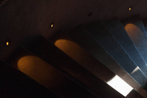 Abstract interior fragment, dark stairway with illumination