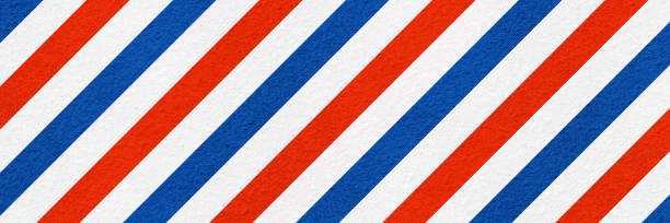 three coloured barber shop banner on coarse plaster texture