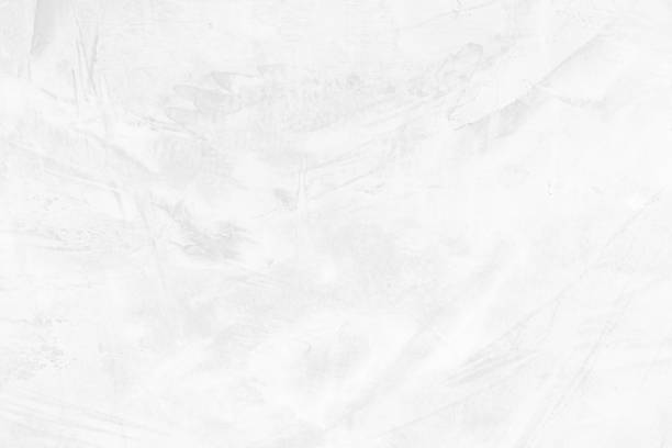 istock The cement wall background abstract gray concrete texture for interior design, white grunge cement or concrete painted wall texture, white cement stone concrete plastered stucco wall painted. 1251090252
