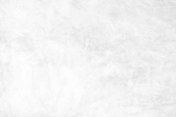 istock The cement wall background abstract gray concrete texture for interior design, white grunge cement or concrete painted wall texture, white cement stone concrete plastered stucco wall painted. 1251090931