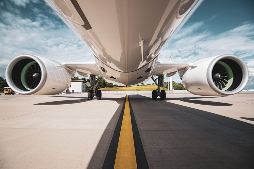 Close-up luxury private jet with an opened gangway door isolated on white background