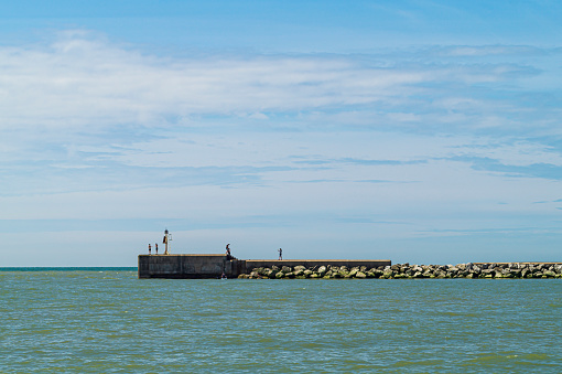 A view of Hastings Harbour Arm at high tide on a sunny day.