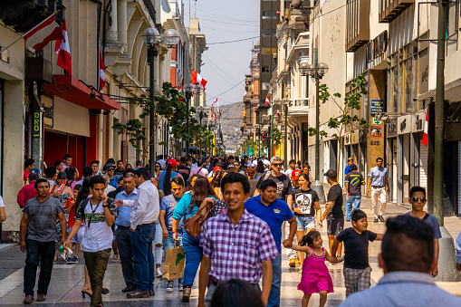 Crowded pedestrian street in historical downtown district and Plaza de Armas in Lima, Peru