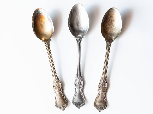 istock two tarnished and one clean vintage silver spoons 1251094346