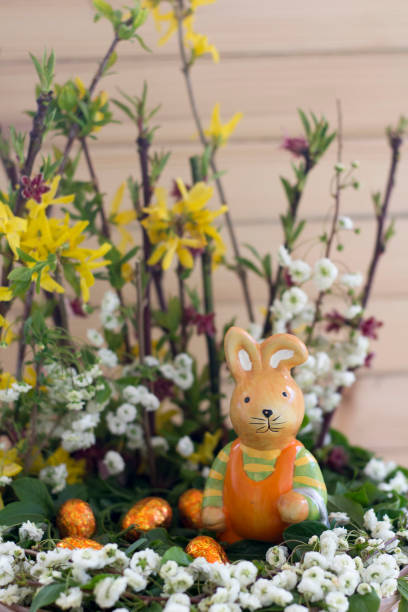 istock Easter Arrangement With Spring Flowers, Ceramic Rabbit And Chocolate Eggs In Basket 1251095449