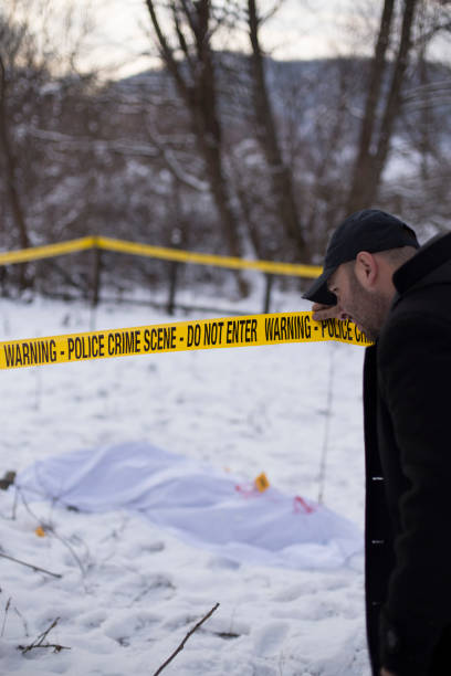 istock Crime scene, snow, detective 1251095552