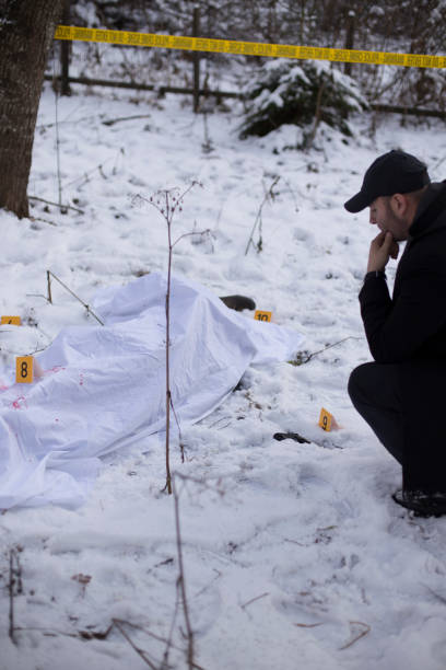istock Crime scene, snow, detective 1251095689
