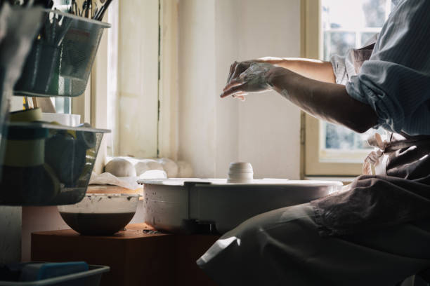 istock Woman Potter Shaping Clay 1251099600