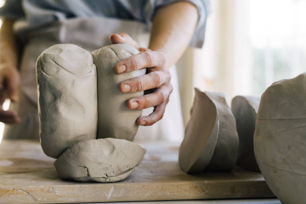 istock Anonymous Woman Sculptor Molding Clay 1251099658
