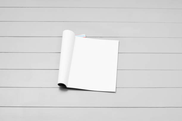 istock Mock-up magazine, newspaper or catalog on gray background. Blank page 1251101294