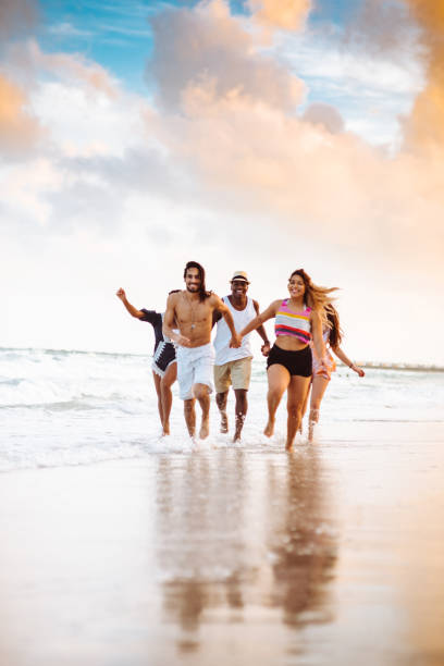 istock happiness friend running happiness on the beach 1251101478