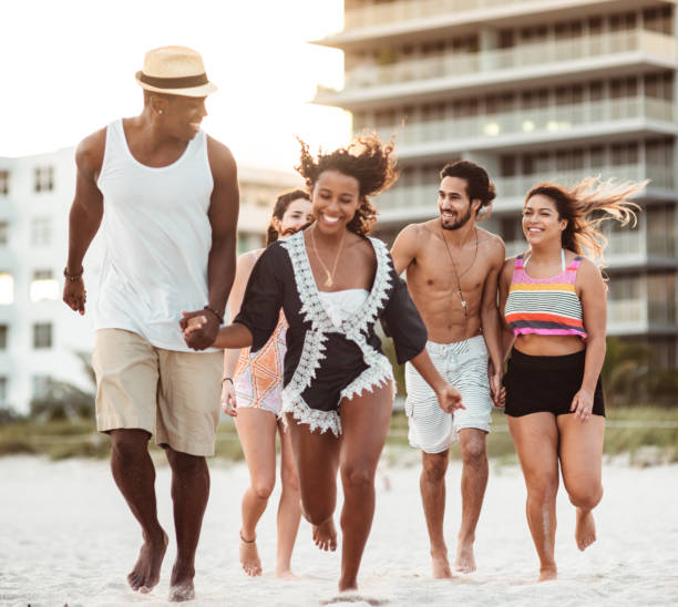 istock happiness friend running happiness on the beach 1251101493