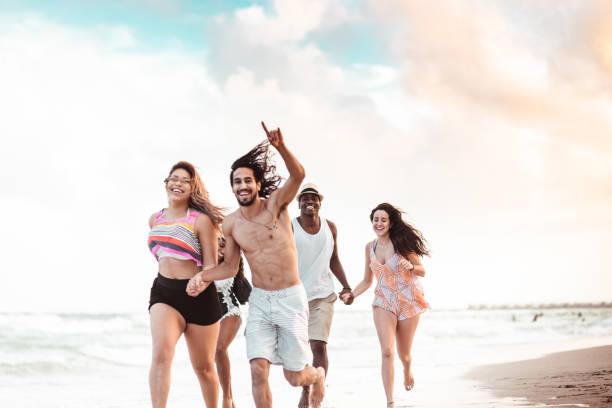 istock happiness friend running happiness on the beach 1251102764