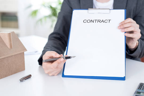 istock businesswoman signing contract 1251107109