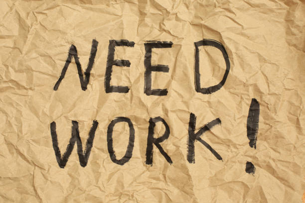 istock NEED WORK sign on Crumpled brown recycled paper background. 1251107185