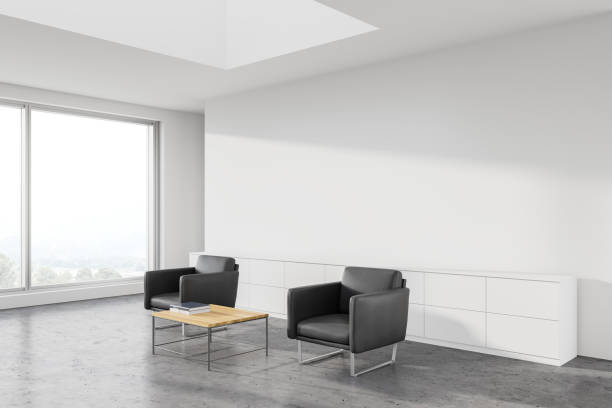 istock White office waiting room corner, grey armchairs 1251109378