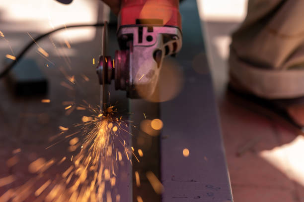 istock Blurred worker using electric grinder machine cutting steel. Steel cutting machine. 1251110342