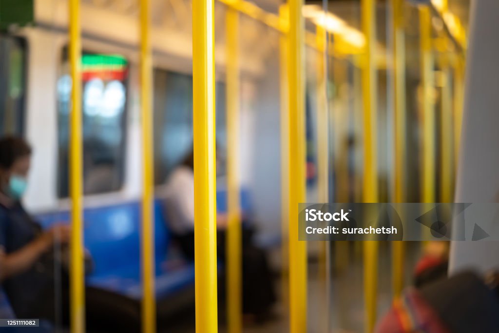 Yellow pole for the passenger to hold while transport inside Airport Rail Link Train. Pole Stock Photo