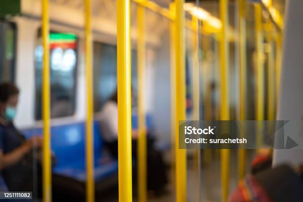 Yellow Pole For The Passenger To Hold While Transport Inside Airport Rail Link Train Stock Photo - Download Image Now