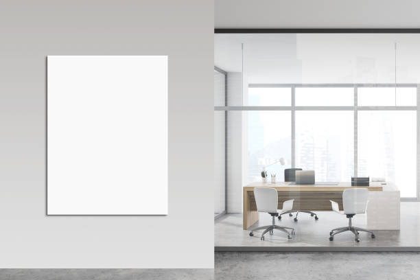 istock White and glass CEO office with poster 1251111920