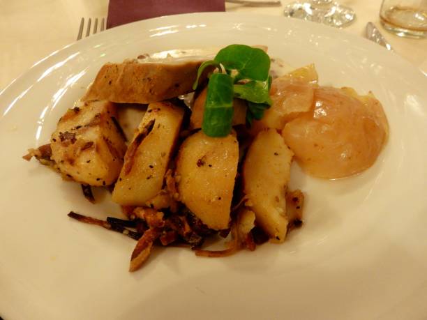 istock Chicken breast with fried apple and bacon potato 1251112013