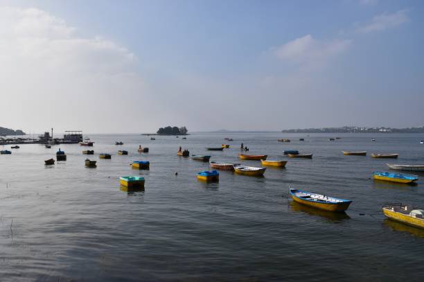 Small multicolor boats Small multicolor boats sailing in the lake, Bhopal bhopal lake stock pictures, royalty-free photos & images