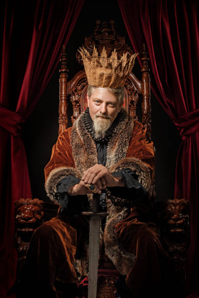 Viking King on the throne in studio shoot Viking King on the throne in studio shoot prince royal person photos stock pictures, royalty-free photos & images