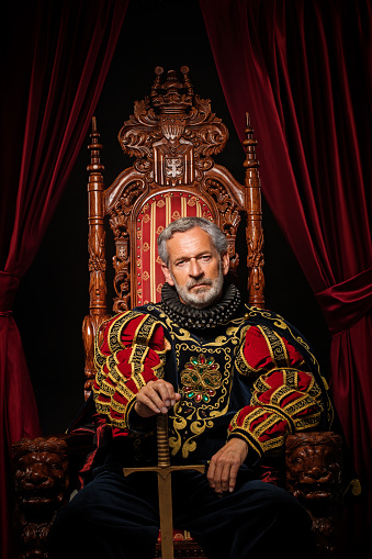 Historical King on the throne in studio shoot