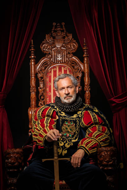 Historical King on the throne in studio shoot Historical King on the throne in studio shoot warrior person stock pictures, royalty-free photos & images