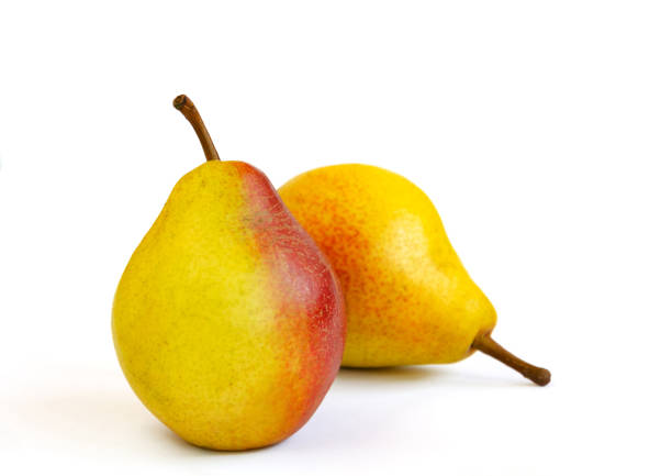 pear fruit, yellow fruits with red sides on a light background, close-up